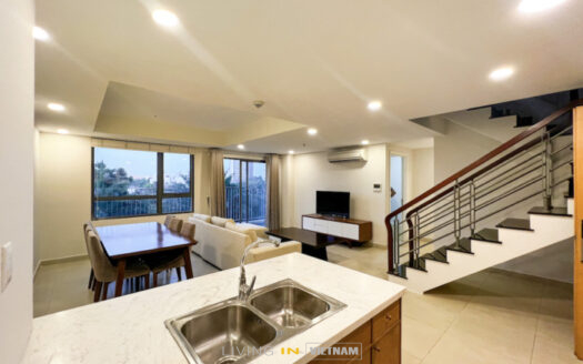 Spacious and Modern Living Room and Kitchen in 4BR Duplex Apartment at Masteri Thao Dien